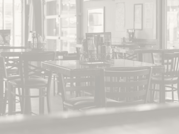 a black and white picture of a dining room in a restaurant